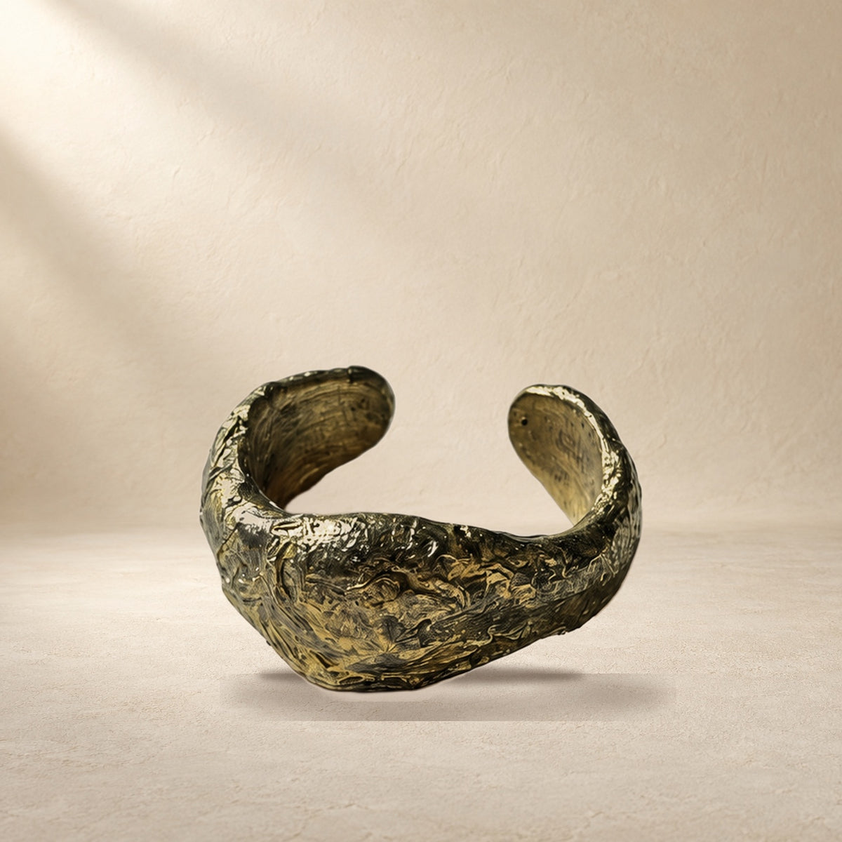 Quiet Compression bracelet resting on a warm cream surface