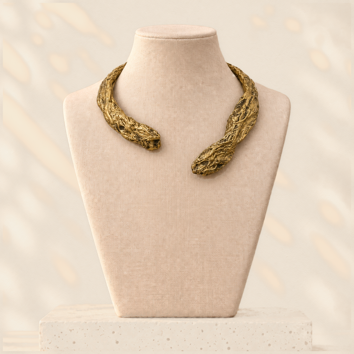 Gilded Divide — Sculptural Paper Collar Necklace on warm cream background