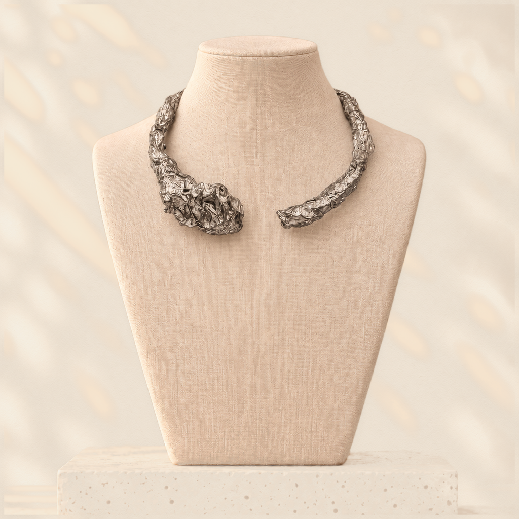 Silver Divide — Sculptural Paper Collar Necklace on warm cream background