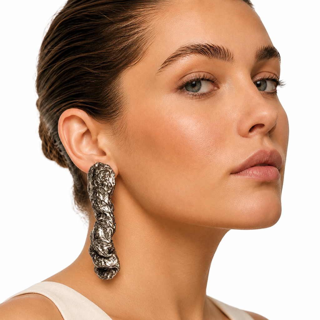 Silver Torsion — Handmade Sculptural Paper Earrings — studio view