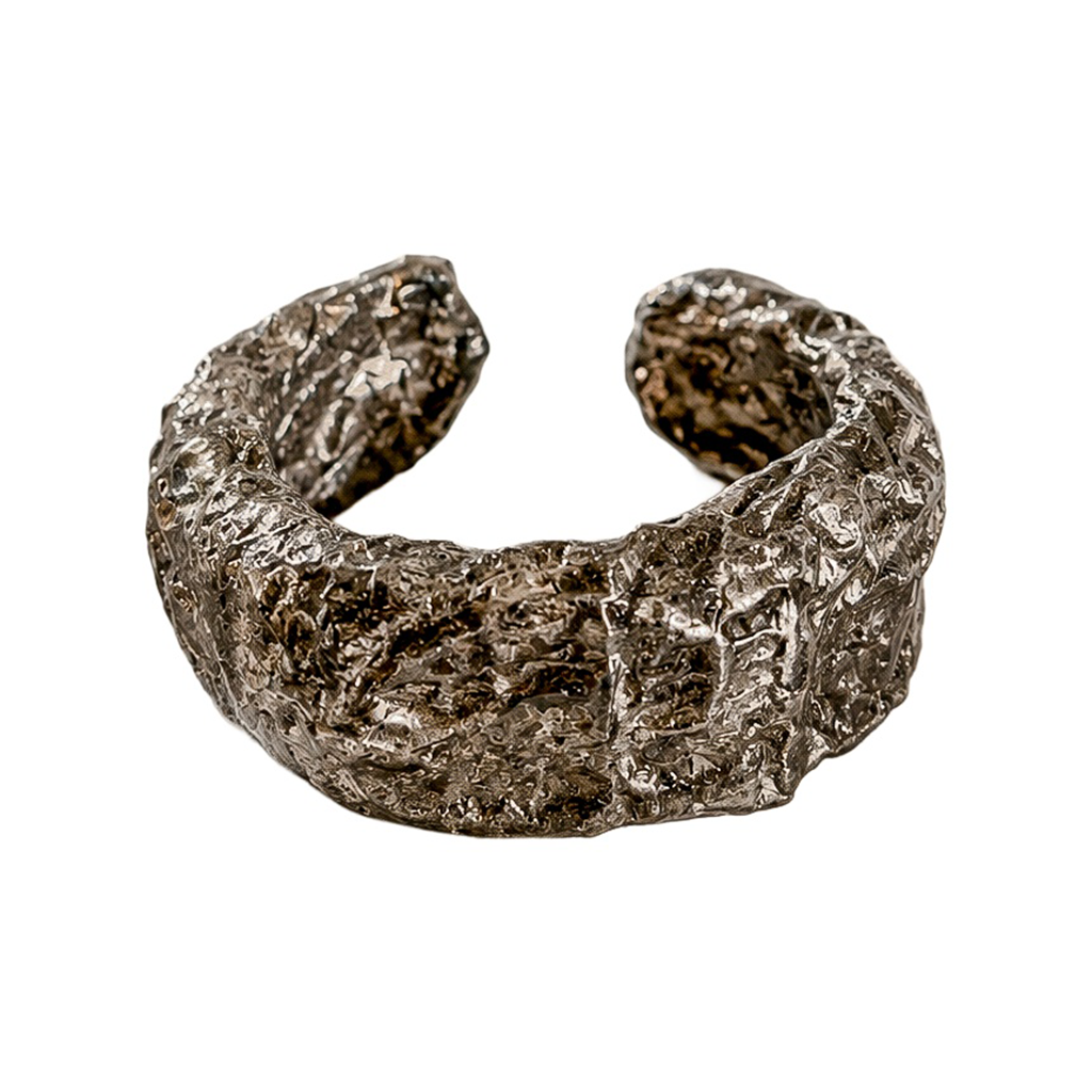 Folded Strata — Sculptural Paper Cuff Bracelet — studio view