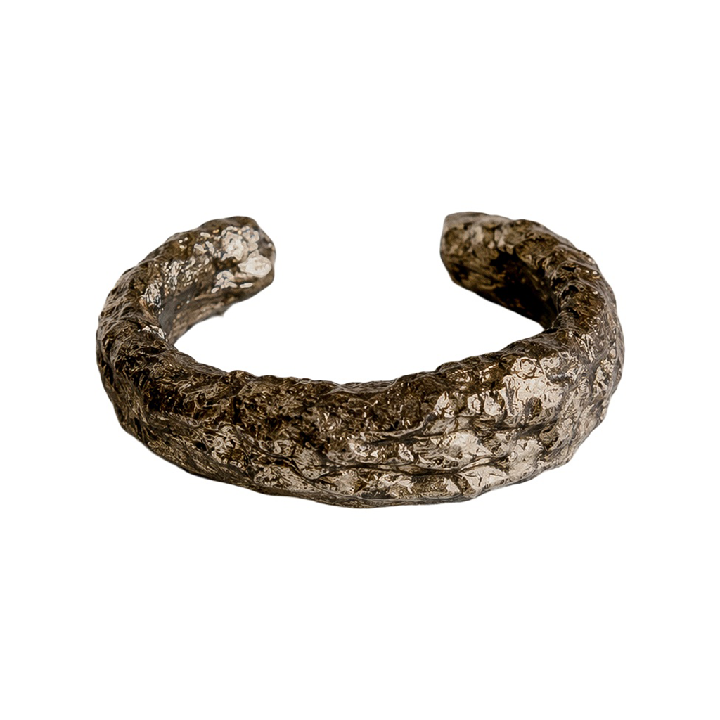 Silver Arc — Sculptural Paper Cuff Bracelet — studio view