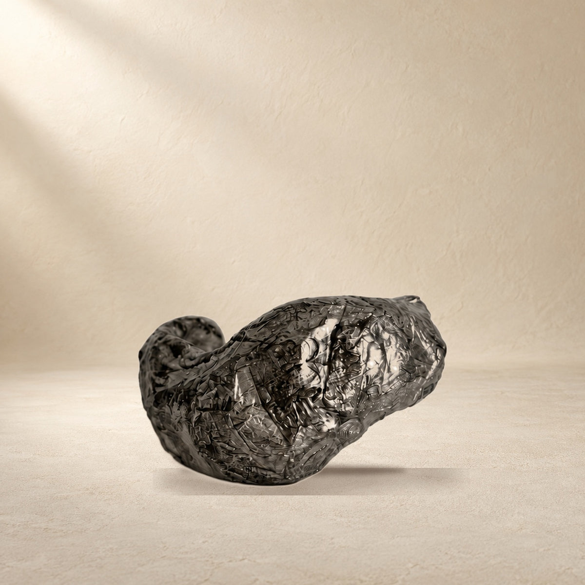 Folded Current bracelet resting on a warm cream surface