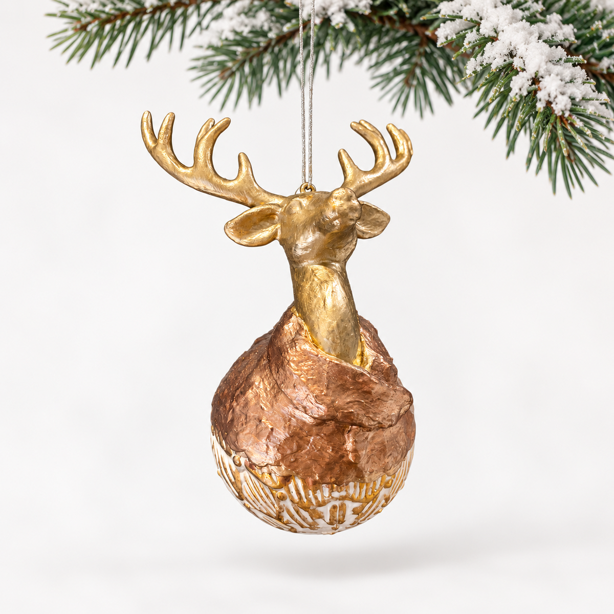 Gold-toned deer head with broad antlers, a copper-toned collar and a patterned spherical base.