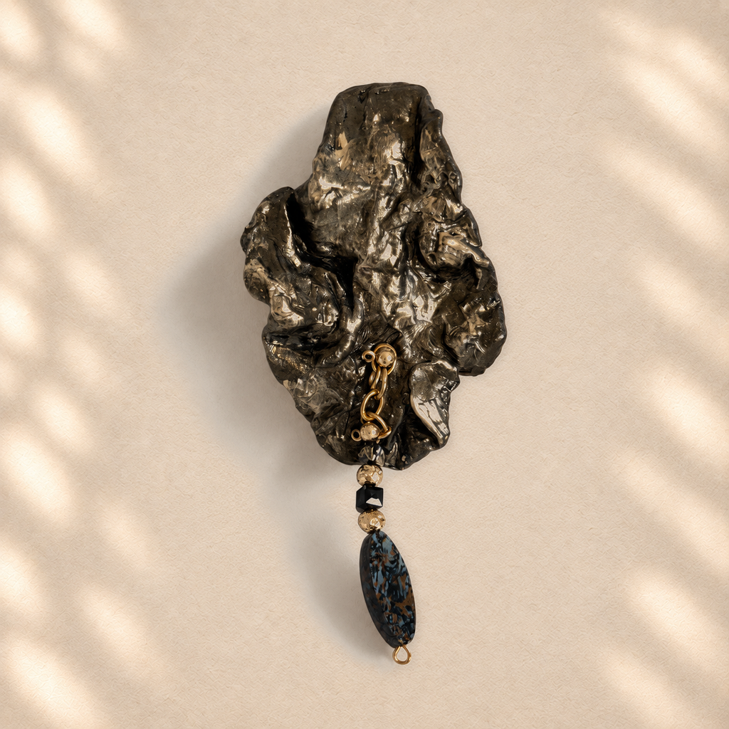 Blue Descent brooch on warm cream background