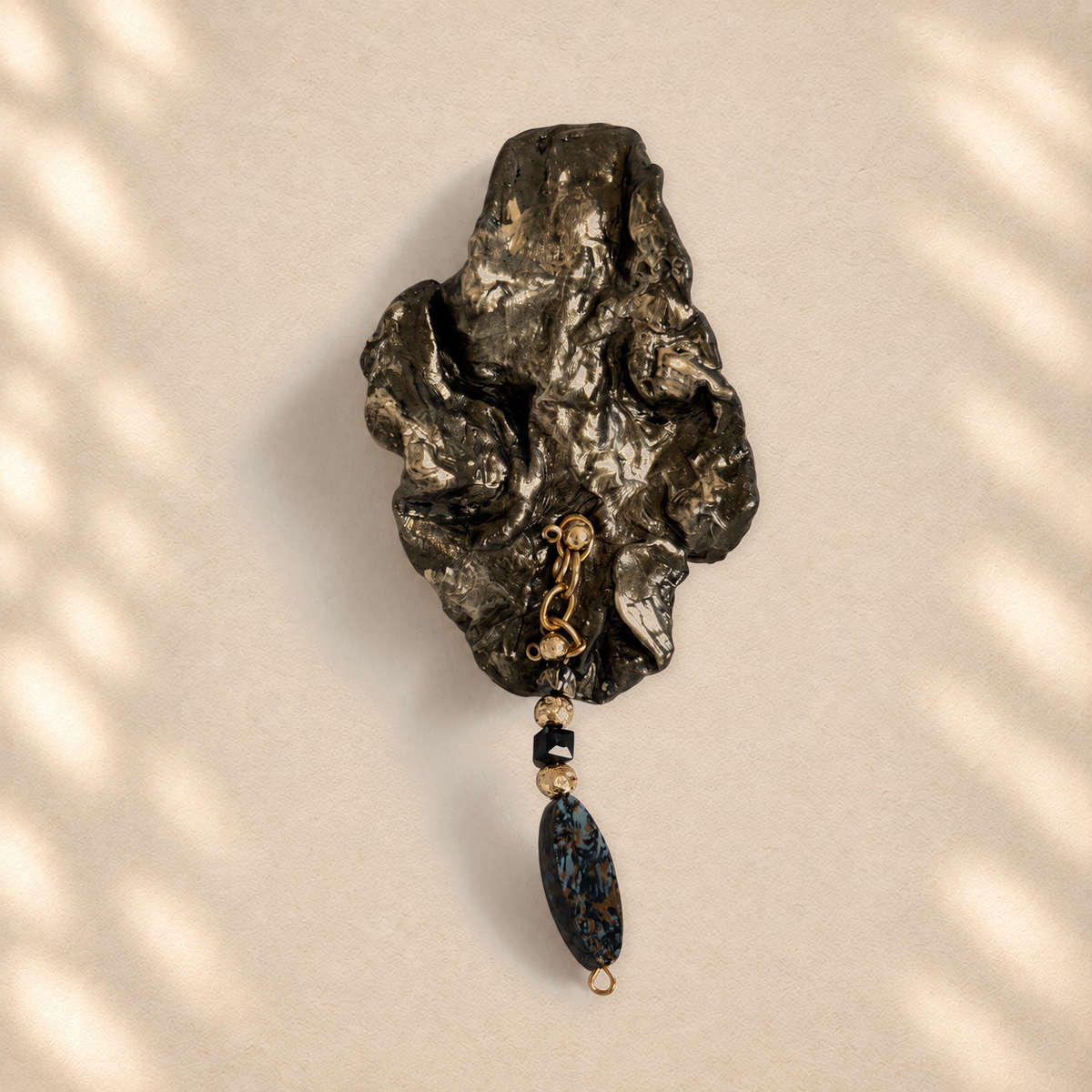 Blue Descent brooch on warm cream background