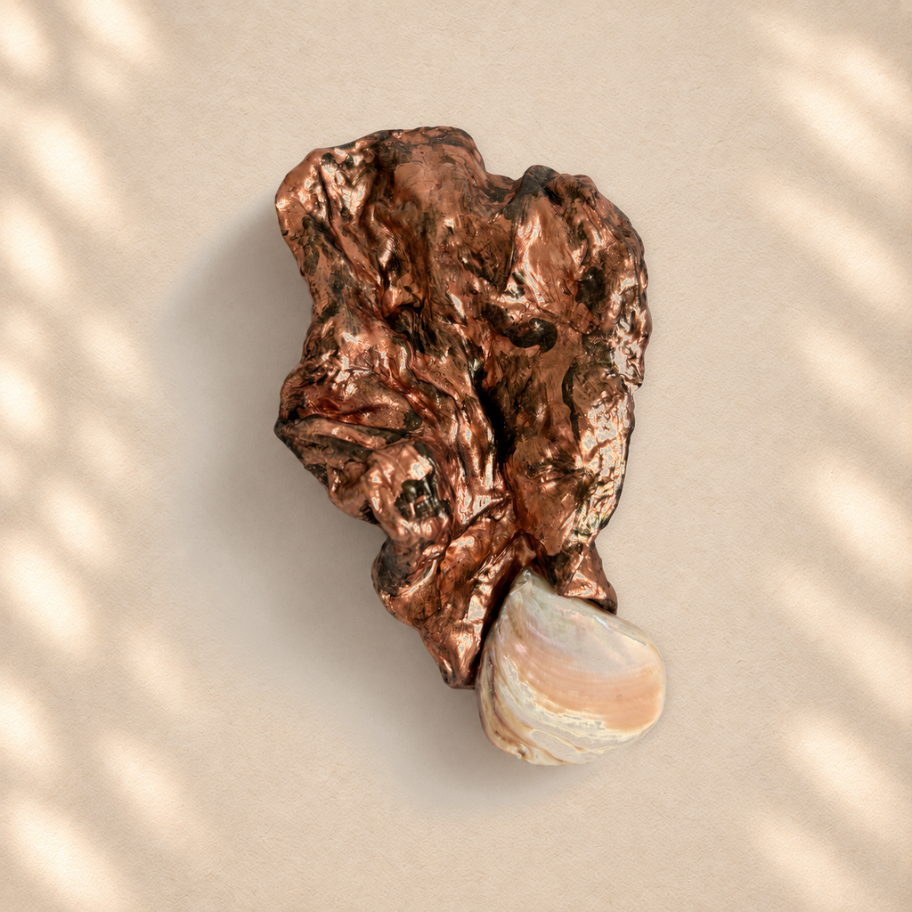 Shell Fold brooch on warm cream background