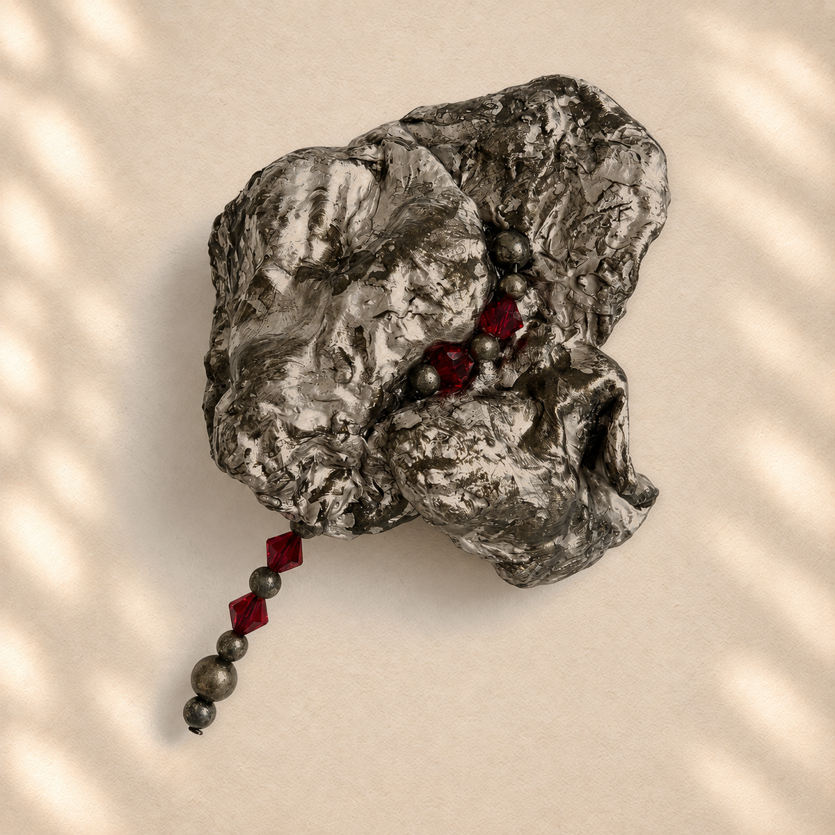 Crimson Trail brooch on warm cream background