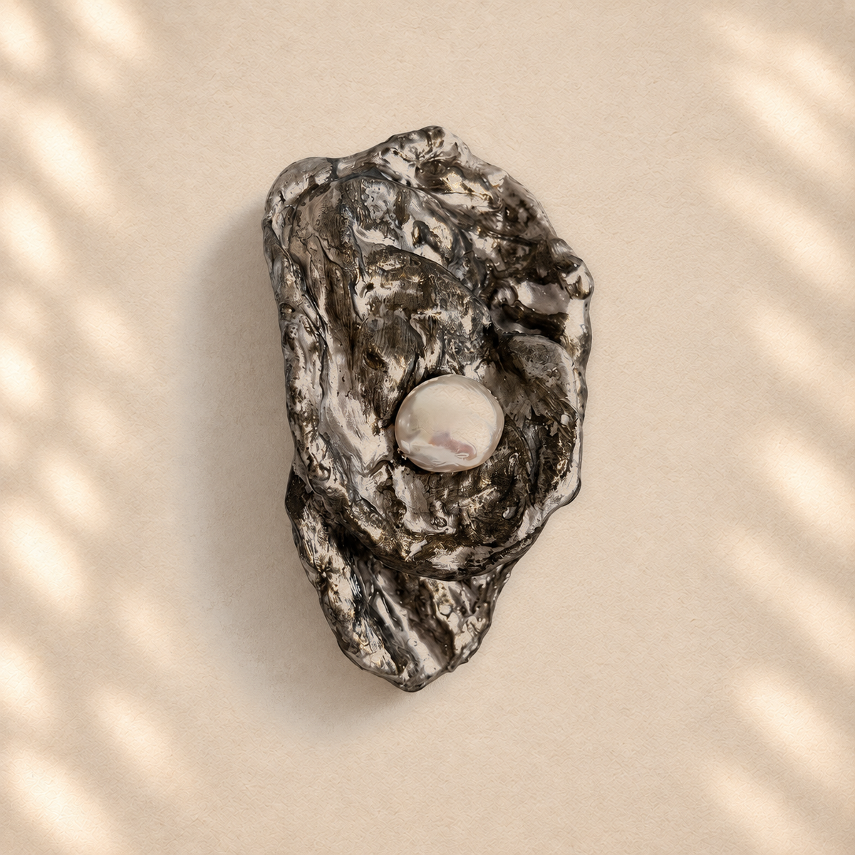 Pearl Hollow brooch on warm cream background
