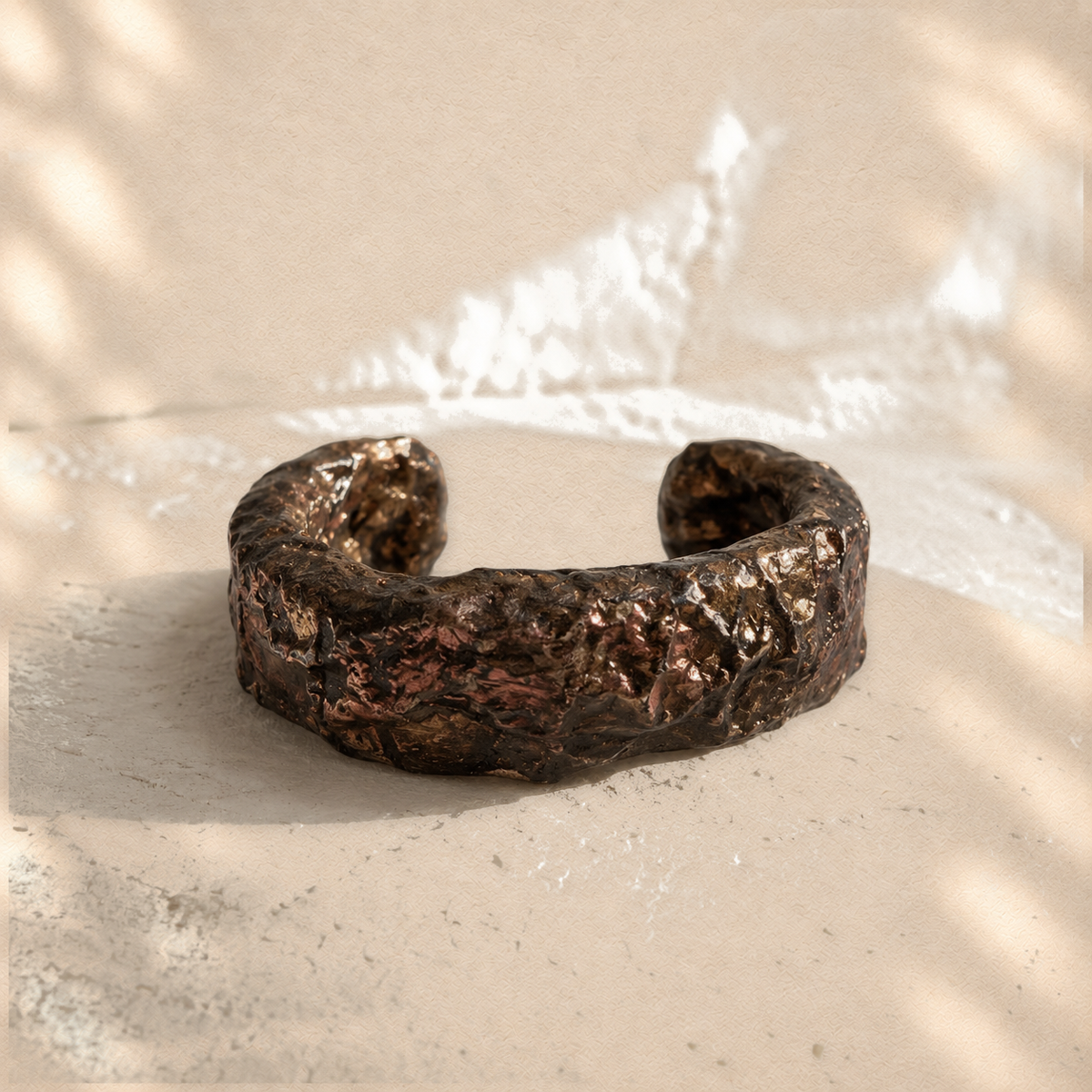 Bronze Horizon — Sculptural Paper Cuff Bracelet on warm cream background