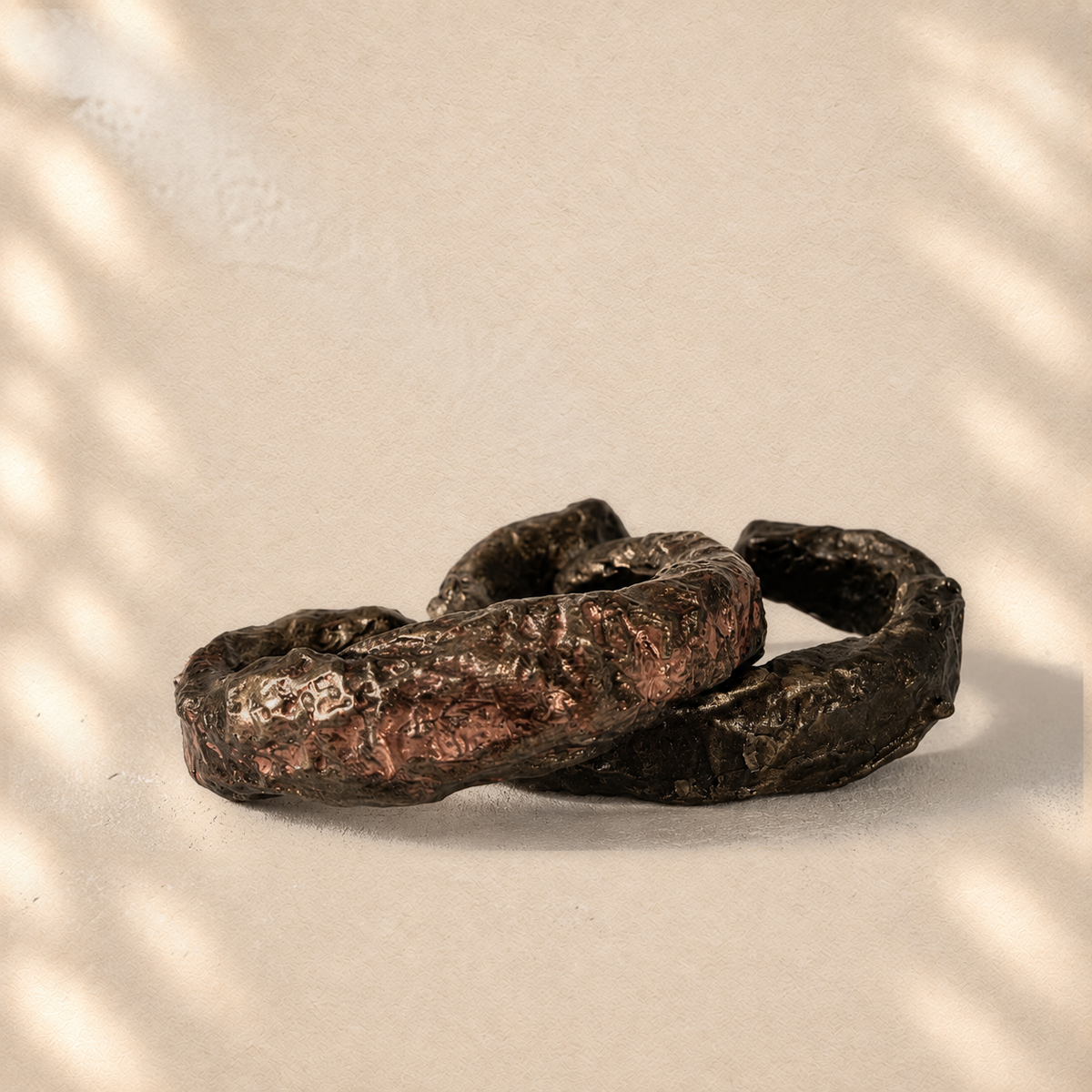 Layered Fault — Sculptural Paper Cuff Bracelet on warm cream background