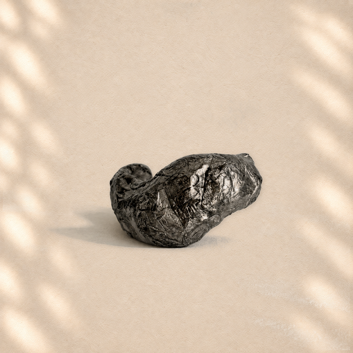 Folded Current — Sculptural Paper Cuff Bracelet on warm cream background