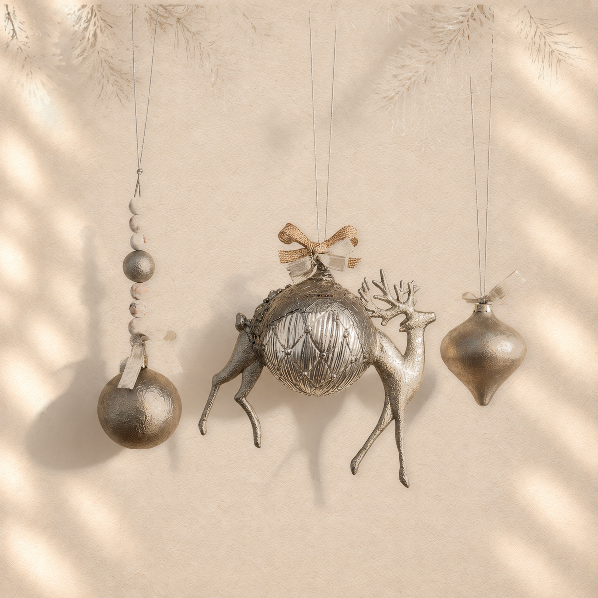 Silver Deer Trio — Set of 3 Sculptural Ornaments on warm cream background