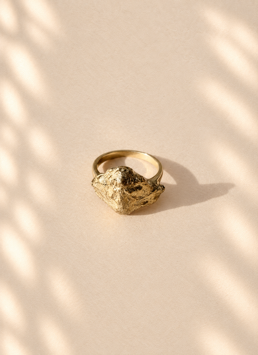 Gilded Knot — Sculptural Paper Ring product only on warm cream background