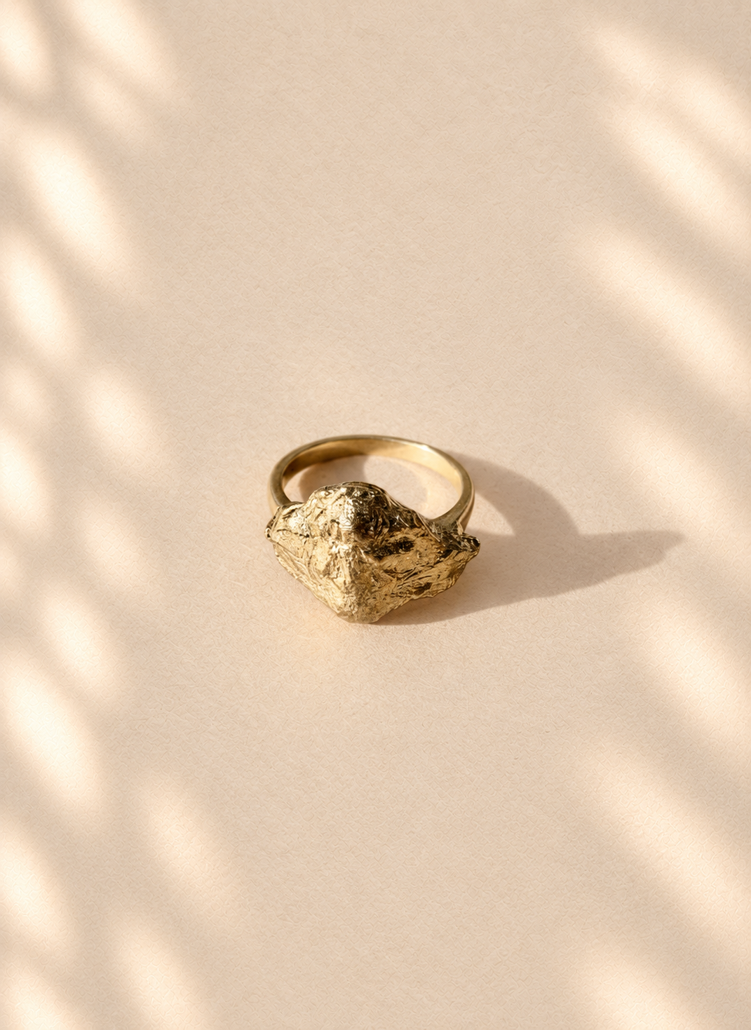 Gilded Knot — Sculptural Paper Ring product only on warm cream background