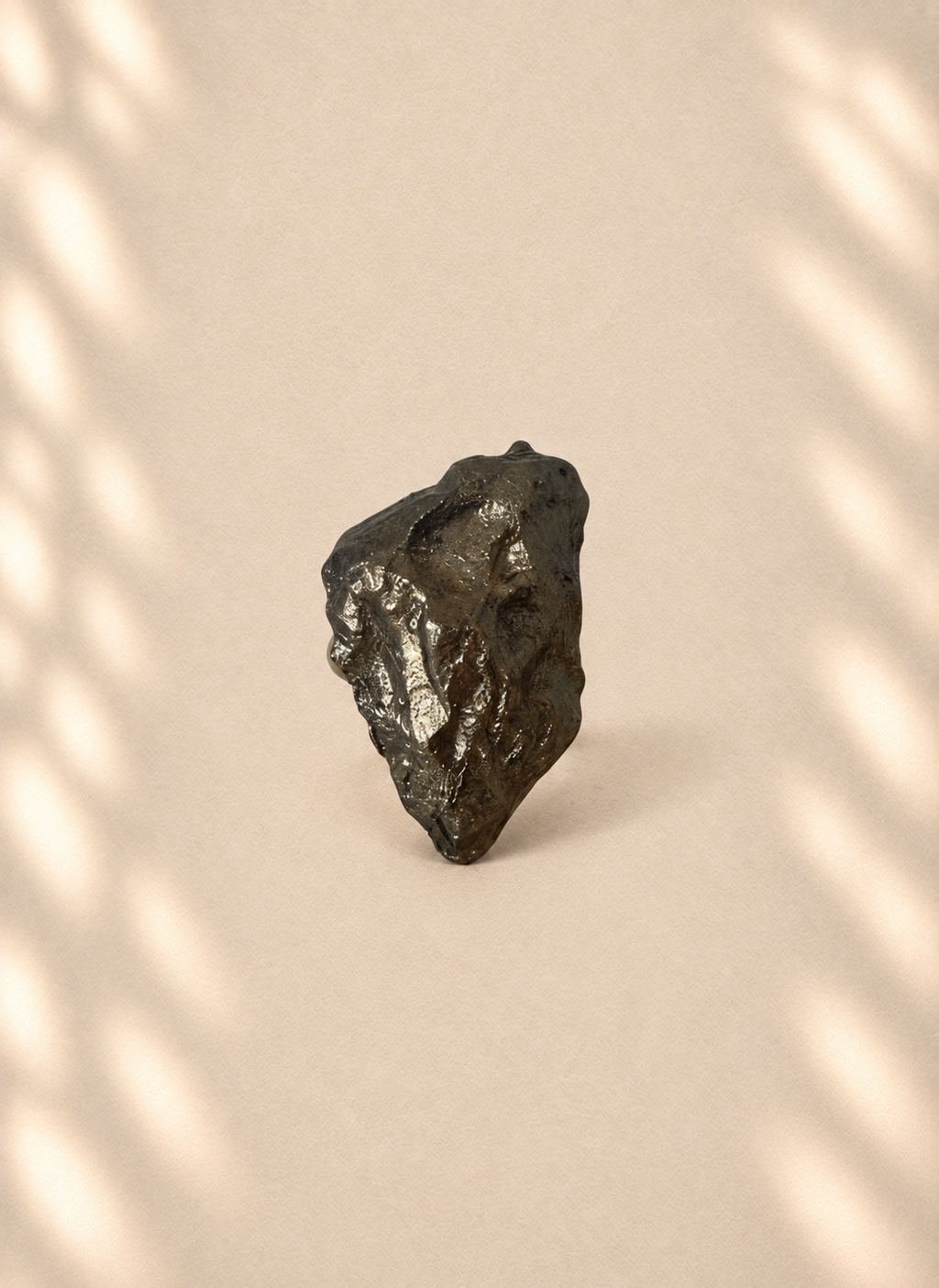 Bronze Fault — Sculptural Paper Ring product only on warm cream background