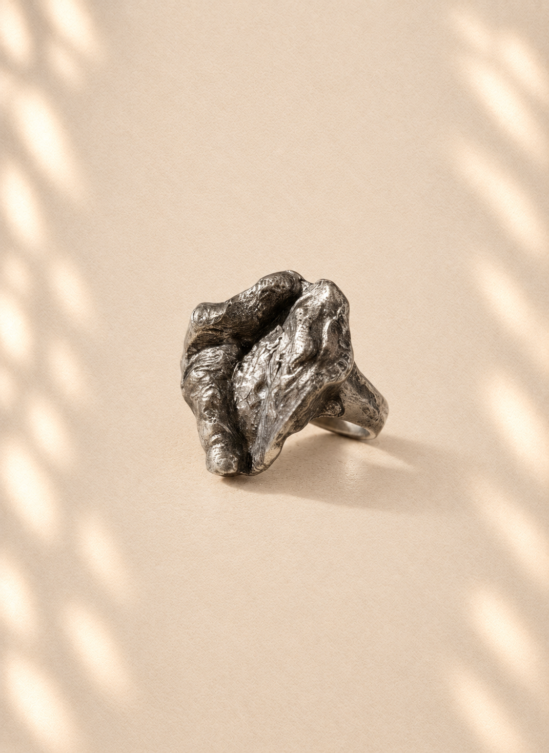 Silver Shield — Sculptural Paper Ring product only on warm cream background