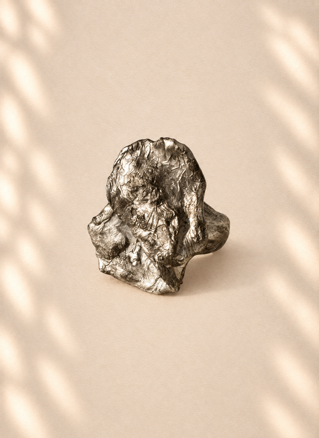 Silver Expansion — Sculptural Paper Ring product only on warm cream background