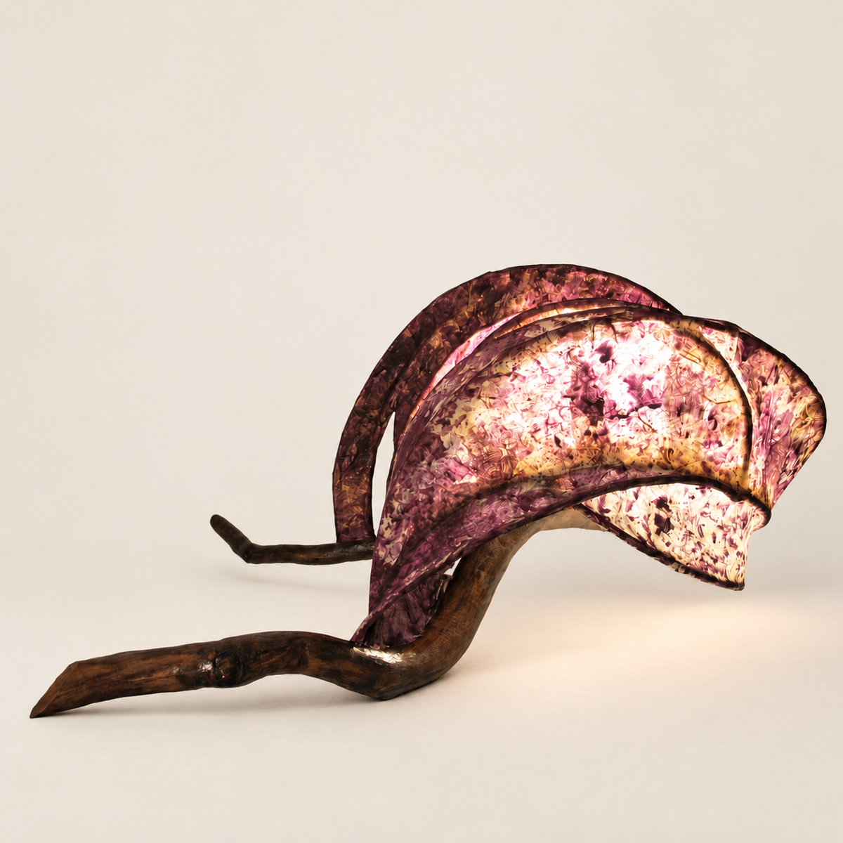 Rose Ember sculptural lamp, main view on warm ivory