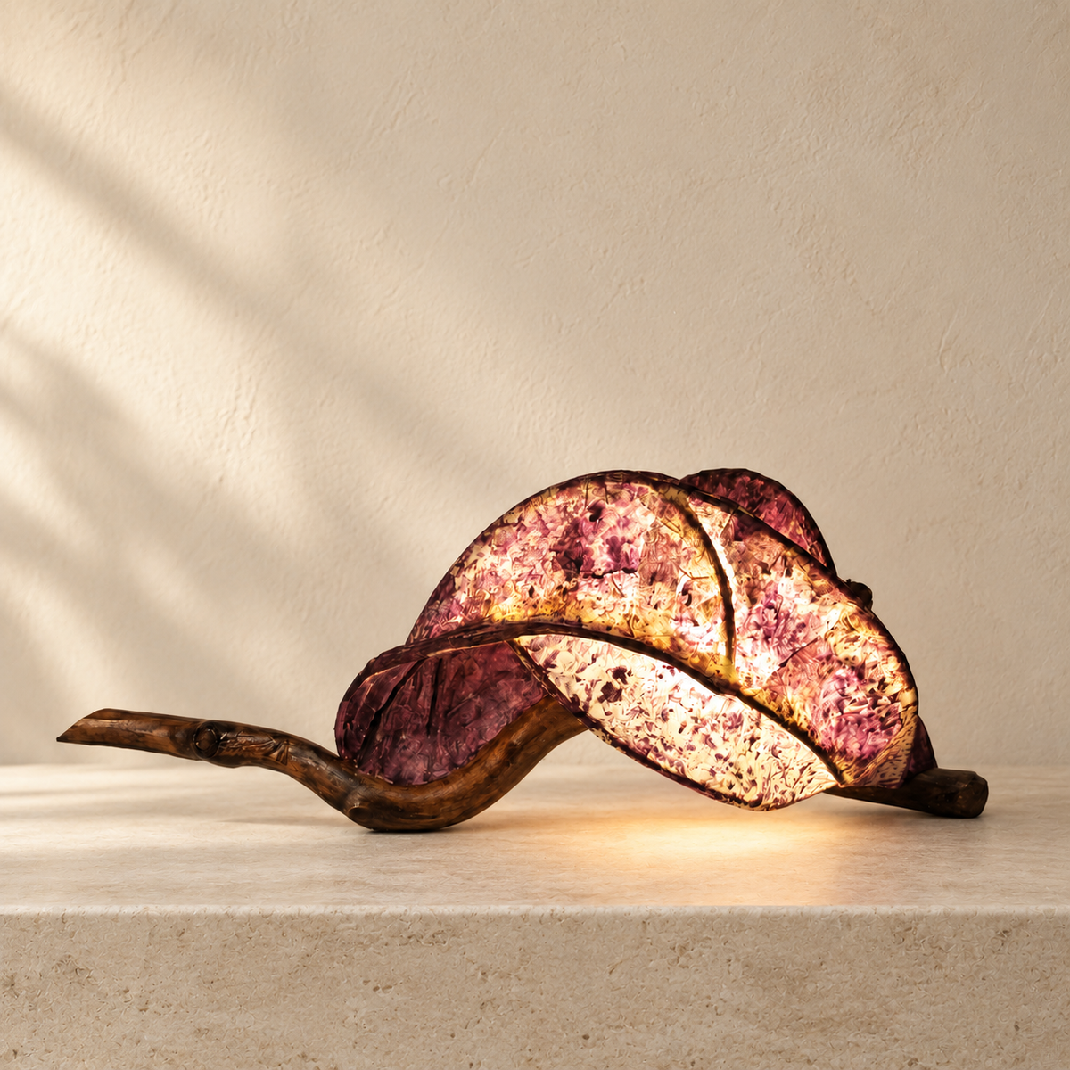 Rose Ember sculptural lamp, alternate side view in a bright minimal interior