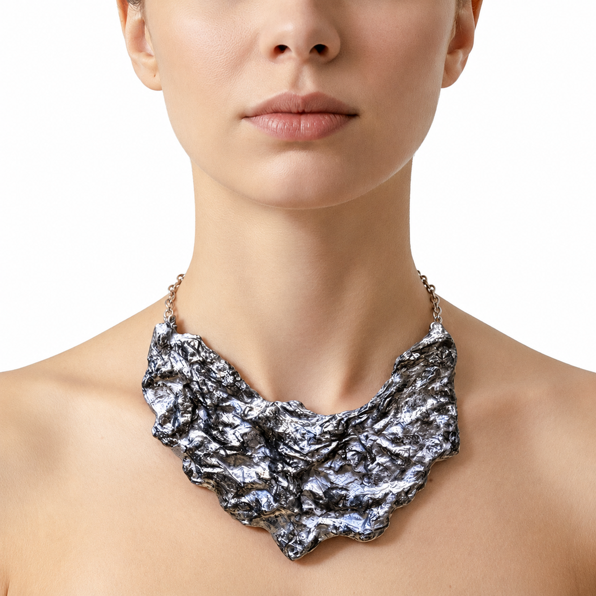 Silver Fault statement sculptural paper necklace shown on a model