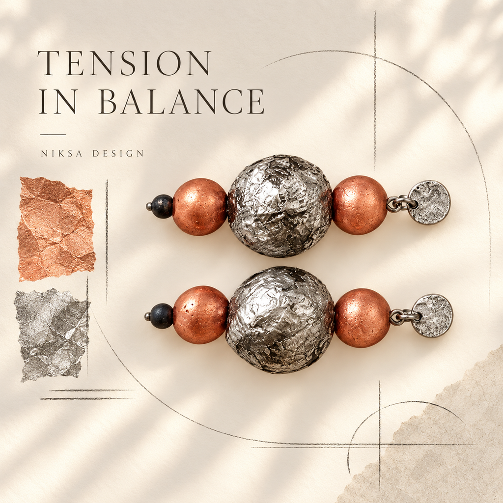 Tension in Balance orange variant - concept showing two copper beads on each earring