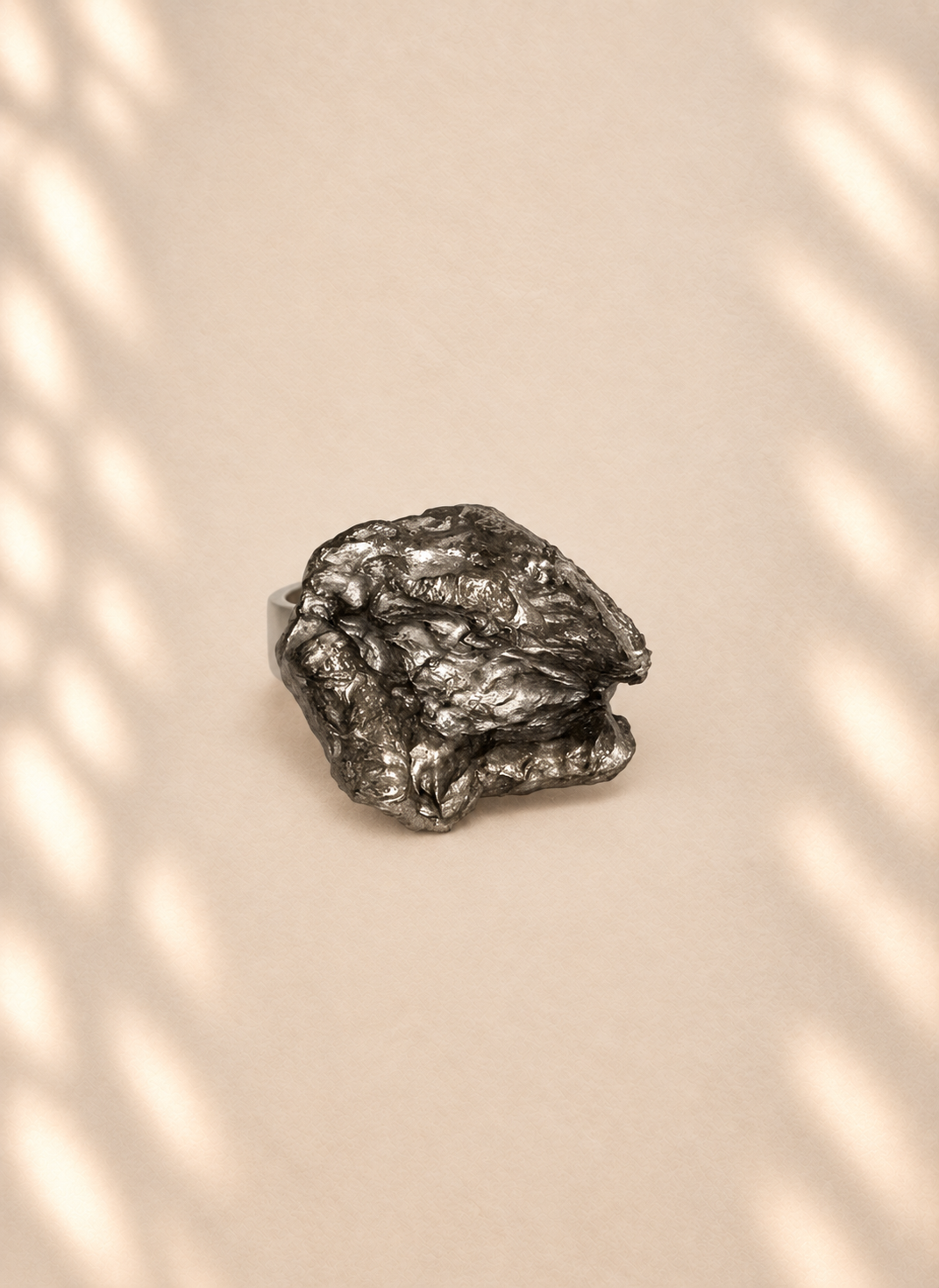 Silver Folded Relief — product photo on ivory background