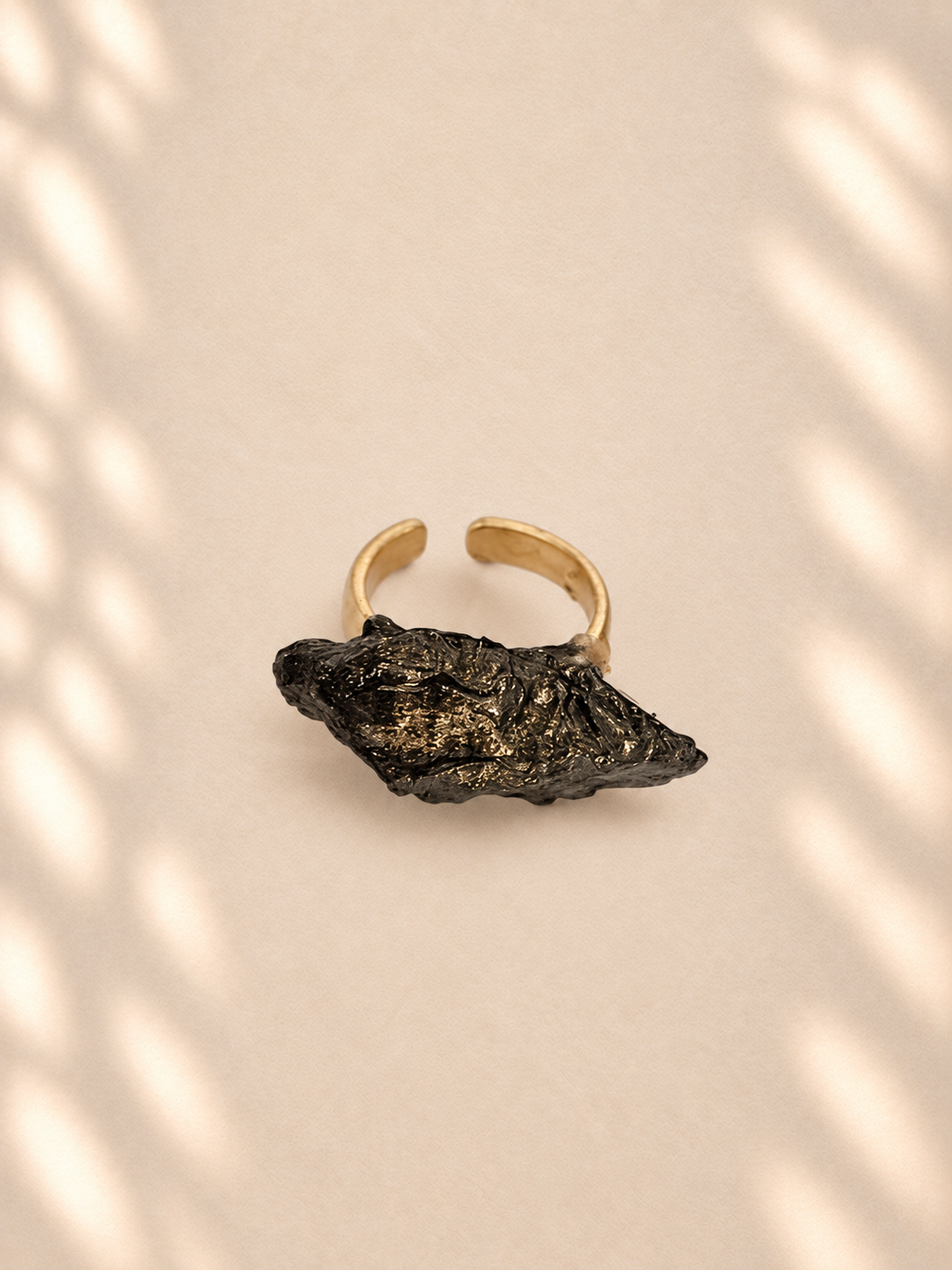 Dark Fold on Gold — product photo on ivory background