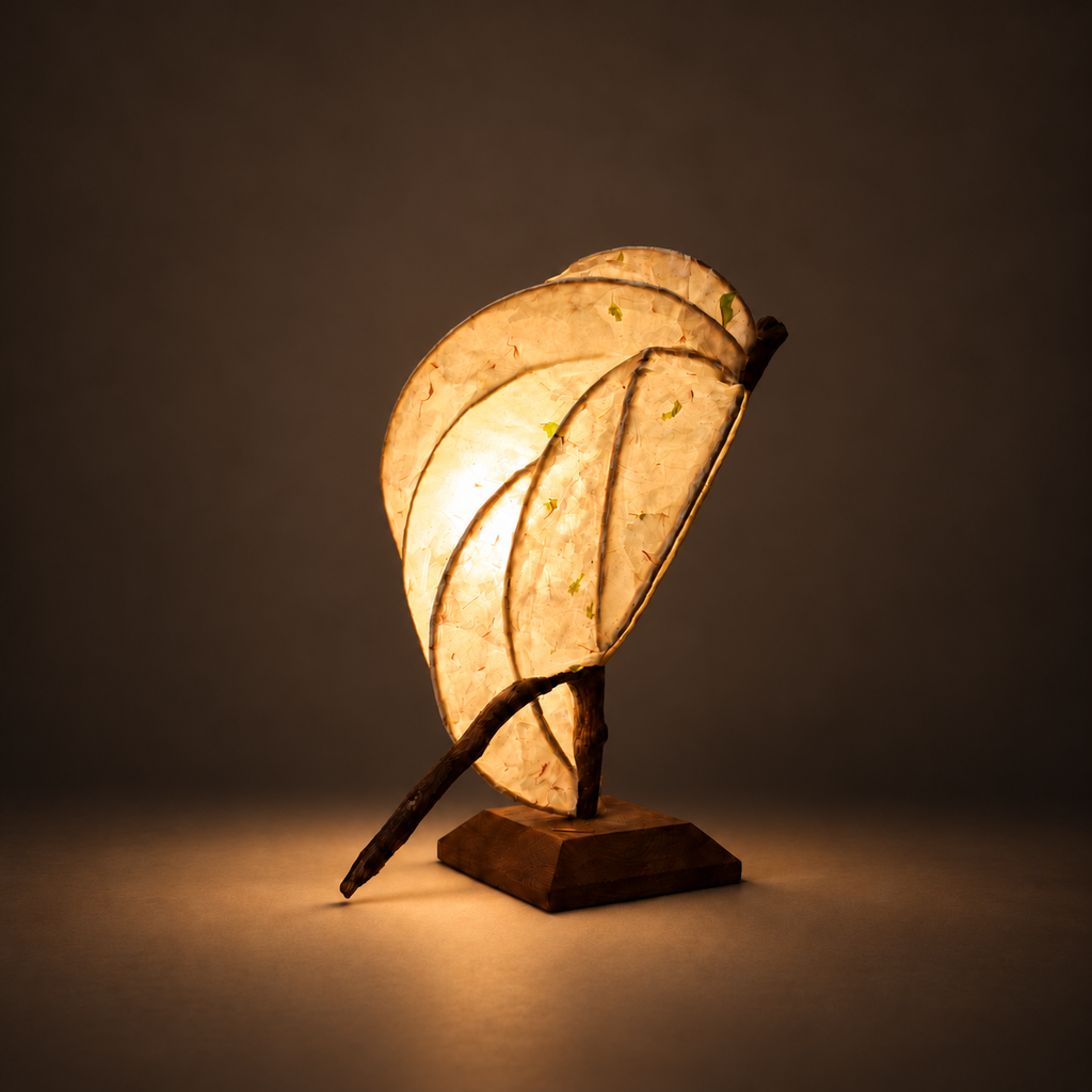 Zarreh sculptural lamp illuminated against a dark warm background
